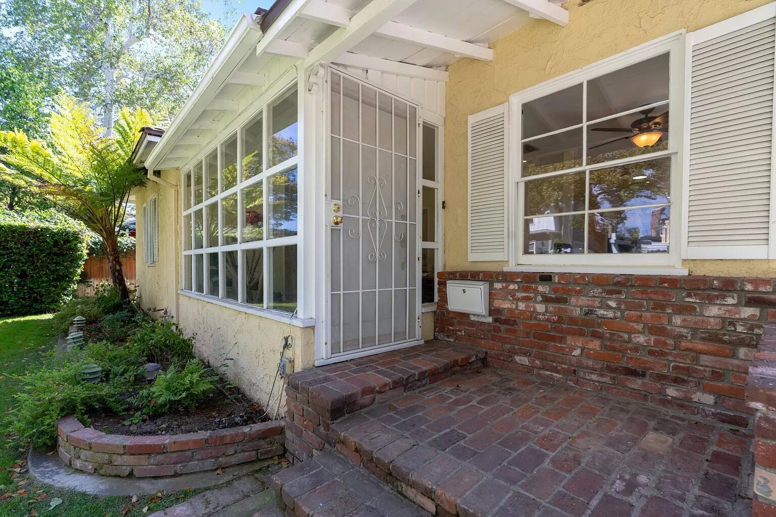 large front porch with a security door - 14024 Peach Grove St