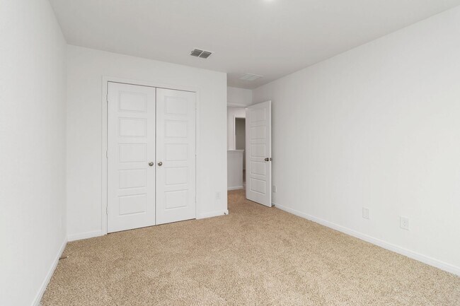 Building Photo - Brand New 4BR Home | Primary Suite Downstairs & Private Yard