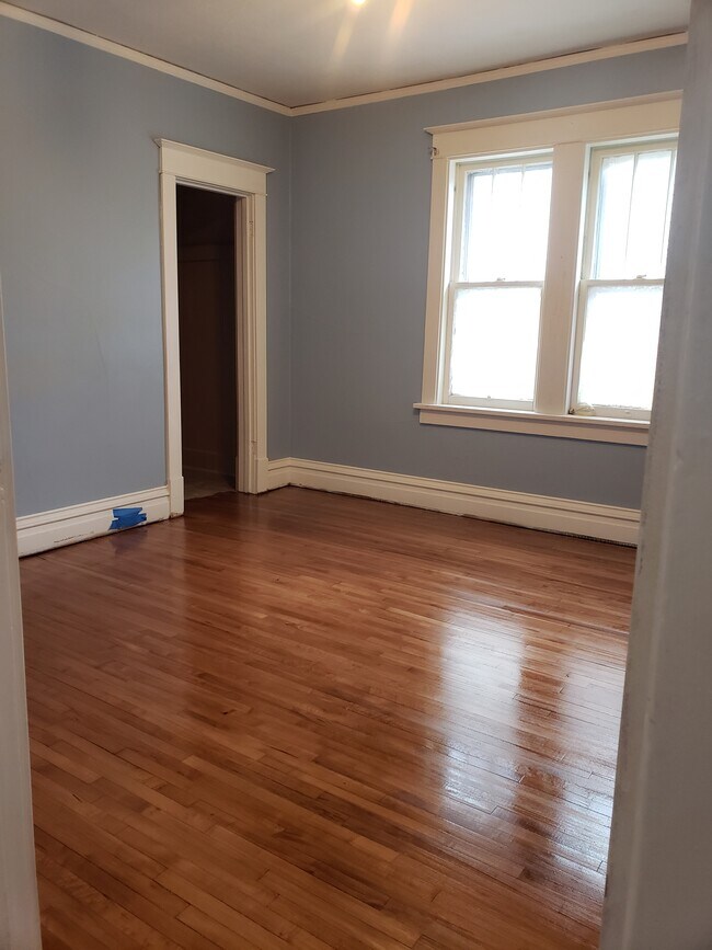 Bedroom #2: Floors completely refinished and fresh paint. - 522 N 42nd Ave W