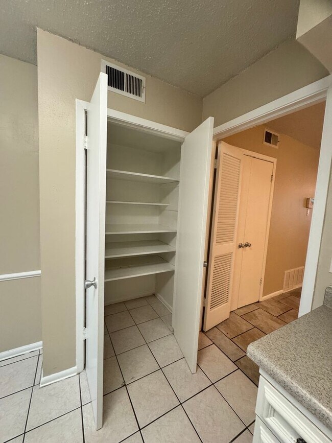 Building Photo - Single-level living on ground floor  |  Fresh paint (July 2026)  |  2 carports  |  Community Pool...