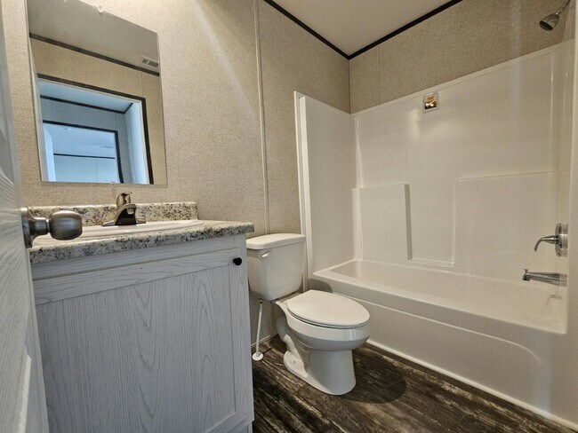 Building Photo - 6591 Hidden Oaks Dr