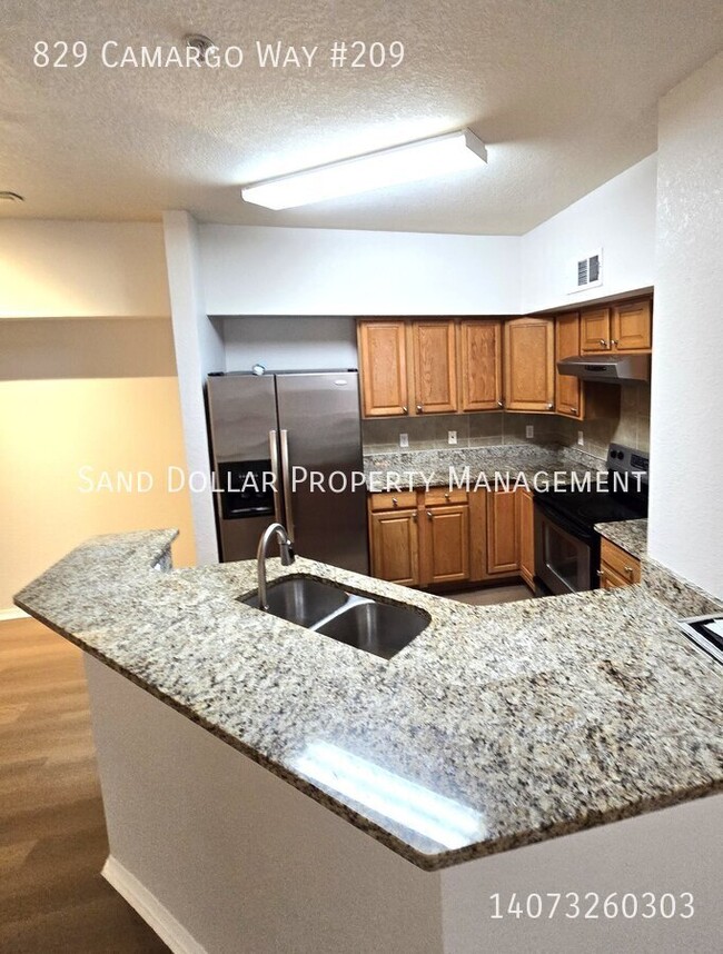 Building Photo - Wonderfully renovated 2nd floor condo in a...