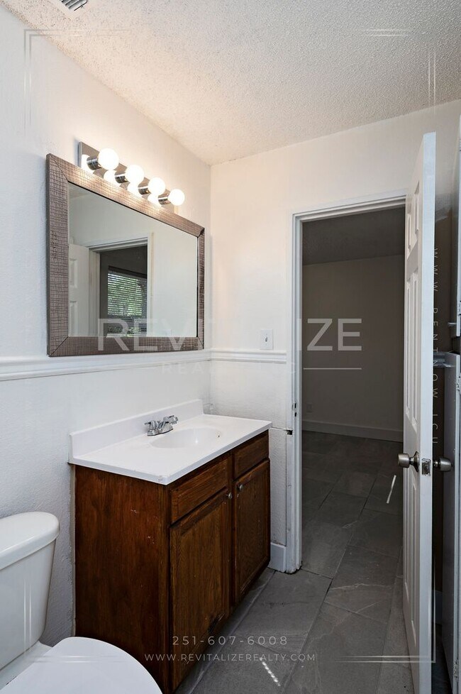 Building Photo - 3 BR 2 BA Home with Fenced Yard & Carport