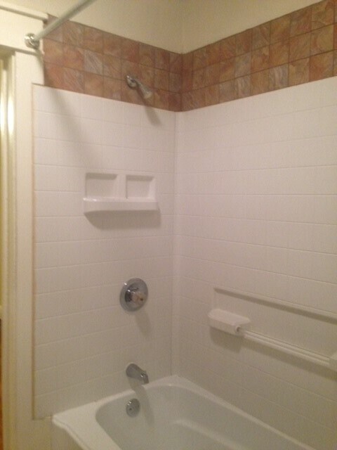 tub with shower - 207 E Vermilya Ave