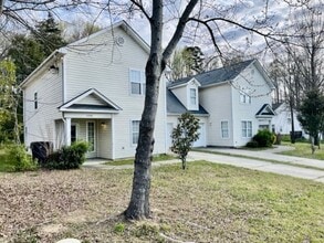 Building Photo - Must see this 4 bedroom 2.5 bath townhouse with 1 car garage .