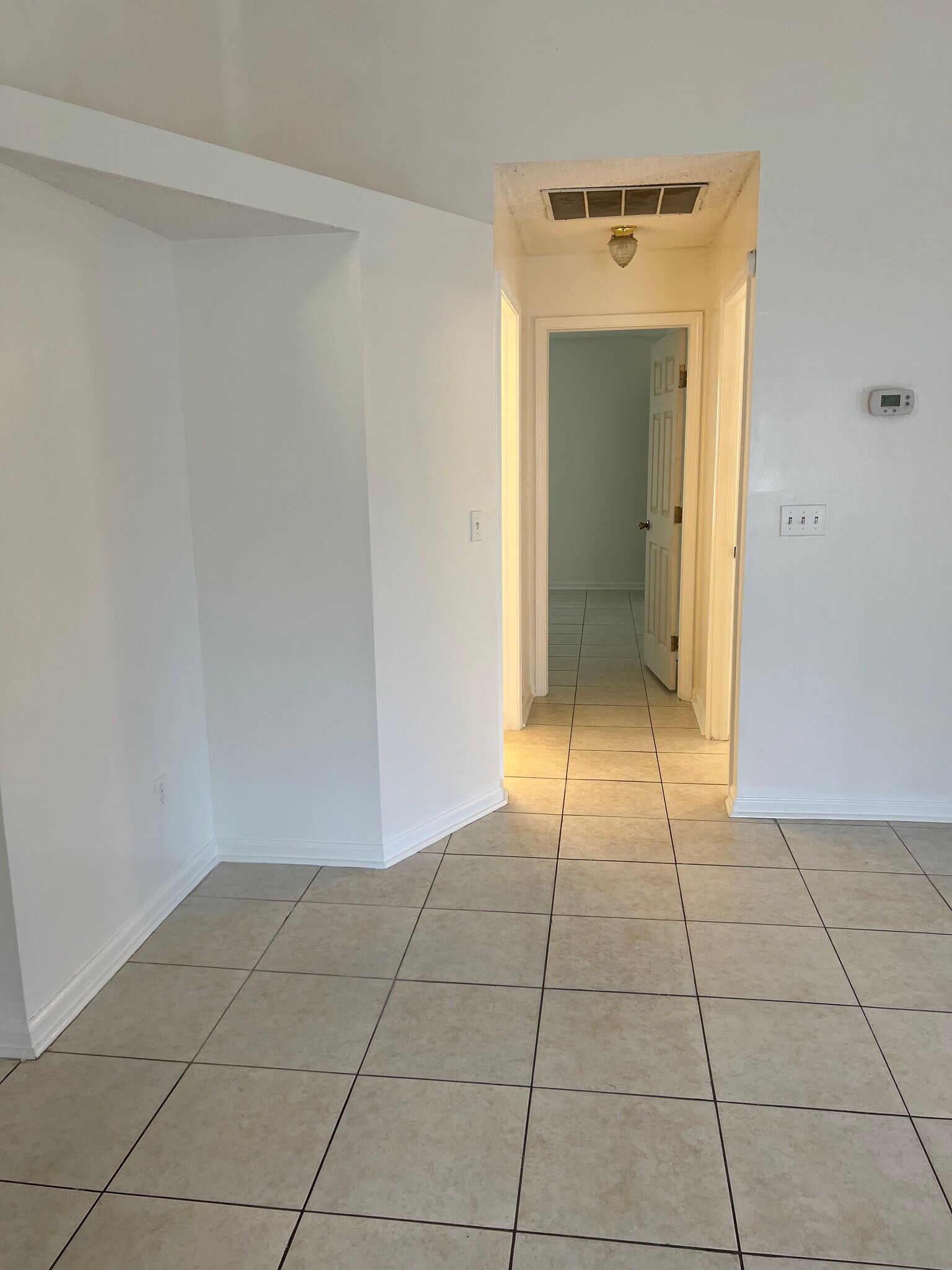 Entrance hallway leads to a split-bedroom layout, offering privacy and separation for family or gues - 5374 Lacy Jane Way