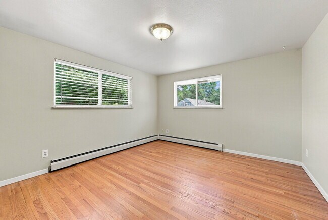 Building Photo - AVAILABLE NOW  Spacious 4-Bedroom Wheat Ridge Home with Finished Garden Level, Two-Car Garage & B...