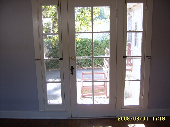 16.1 Primary Bedroom- French doors to backyard - 680 Highland St