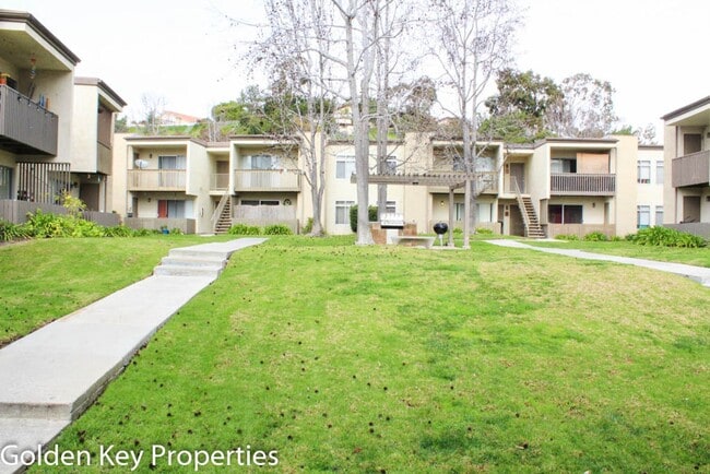 Building Photo - Cozy ground-level unit in the gated commun...