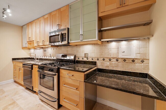 Building Photo - Spacious, and Sunlit 1 BD/1 BA Condo w/Reserved Garage Parking and Utilities Included in Chevy Ch...