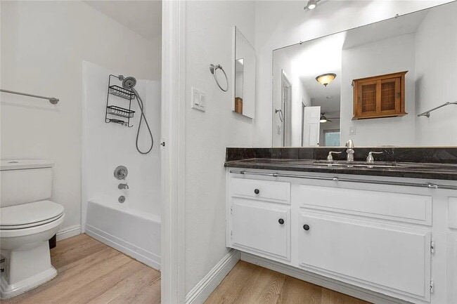 Building Photo - "Charming 1-Bedroom Furnished Retreat with...