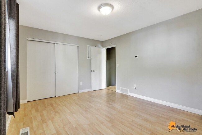 Building Photo - Eagle River Home w/ Fenced Yard, Sunroom, and Garage!