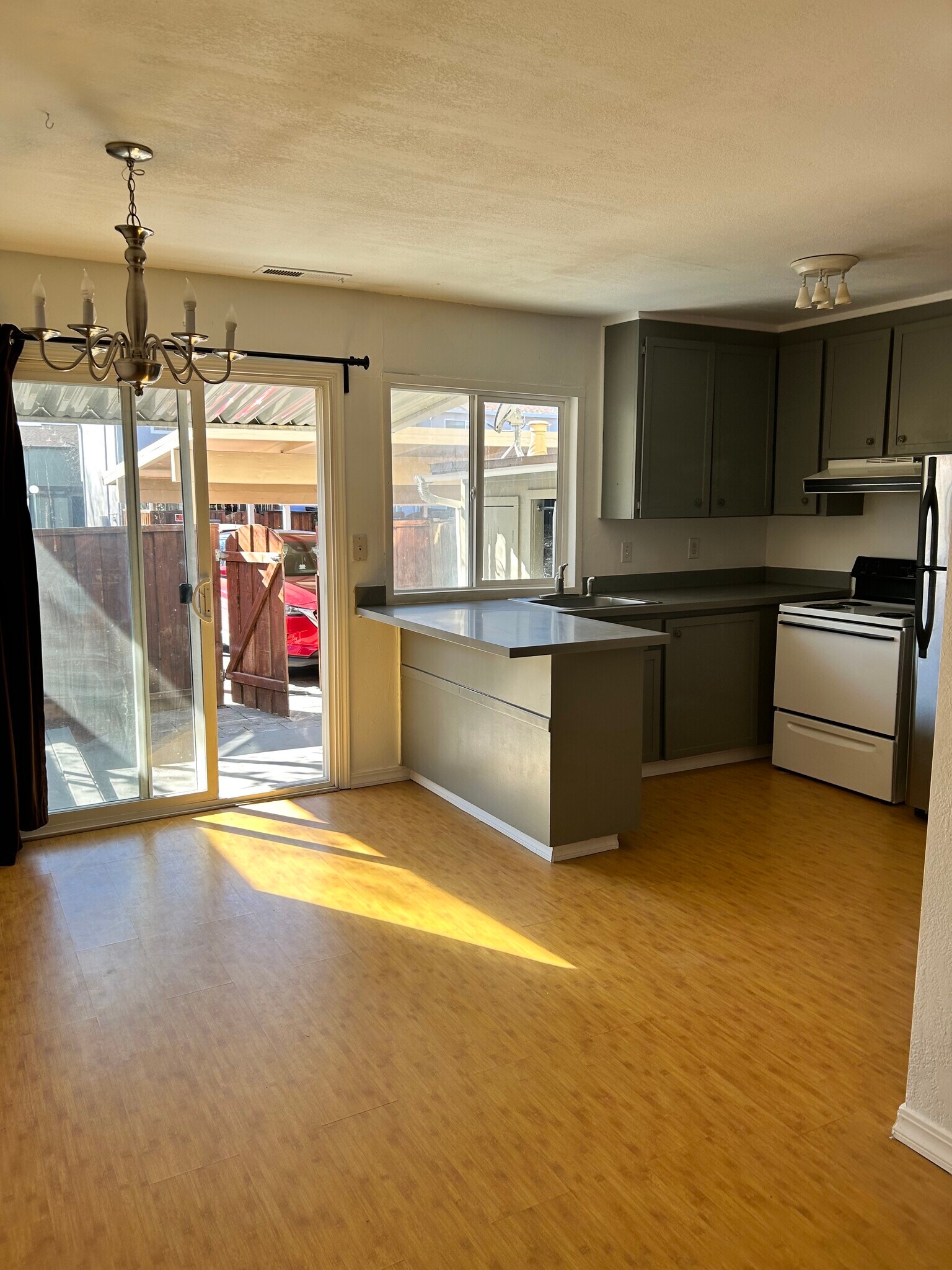 kitchen and covered parking next to back patio - 1895 Landana Dr