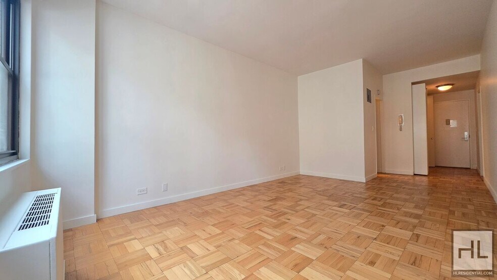 Building Photo - Bright Ninth-Floor Studio with Exceptional Closet Space near the UN