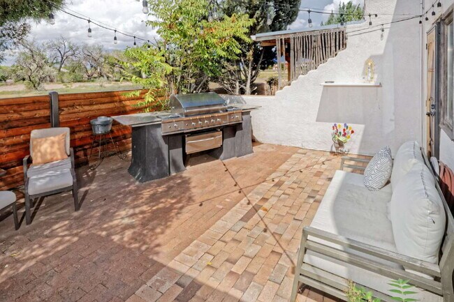 Building Photo - One-of-a-kind adobe brick home backing up ...