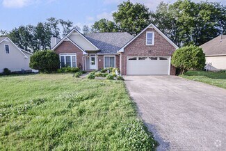 Building Photo - Pet Friendly Three Bedroom with Bonus!