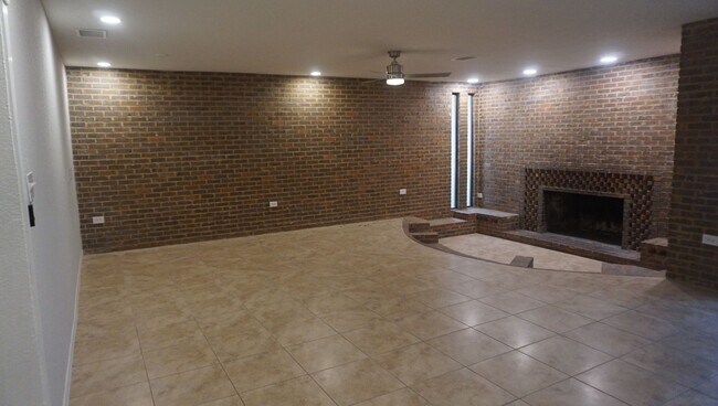 Building Photo - Four Bed - Three Bath - Large Storage Area...