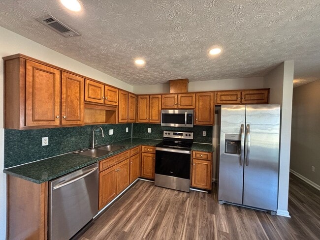 Building Photo - Keys to Happiness – Unlock Your New Home.