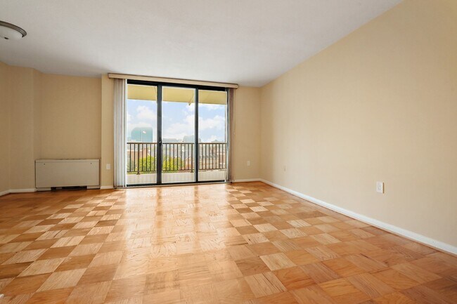 Building Photo - Spacious, and Sunlit 1 BD/1 BA Condo w/Reserved Garage Parking and Utilities Included in Chevy Ch...