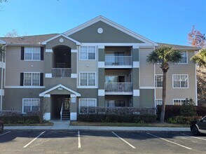 Building Photo - Beautiful 2BR/2BA Condo in Sunset Lakes – Lake & Tree Views!