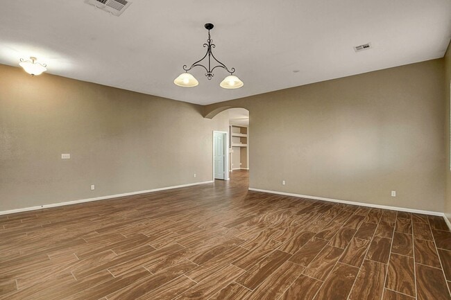 Building Photo - Gorgeous NW Single Story! 3 Car Garage! Serene Backyard.