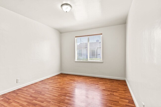 Building Photo - Renovated 1-Bedroom with Gated Parking & Garbage Paid!