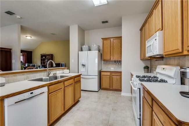 Building Photo - Darling 1 story 3 Bedroom home 2 car garage