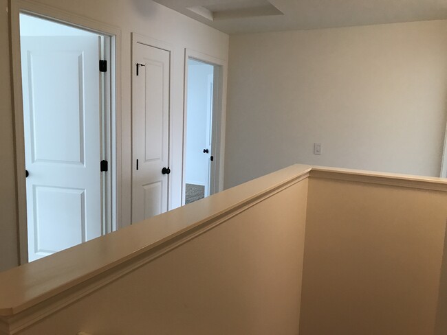 View of upstairs bedroom 1 & 2 from the top of the stairs - 1280 SW Selway Ln