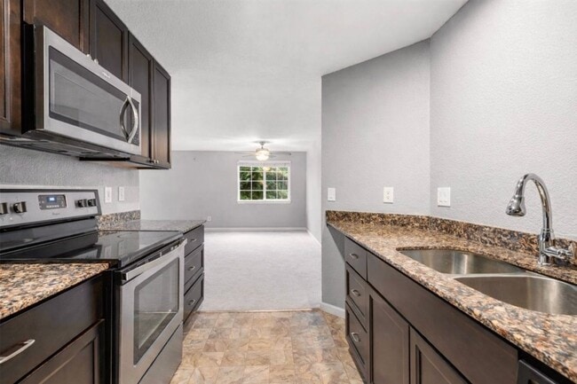 Building Photo - 2-Bedroom, 2-Bathroom End Unit with Covered Balcony