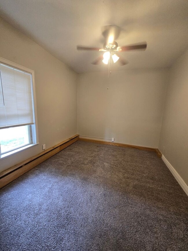 Building Photo - This updated and welcoming condo in the he...