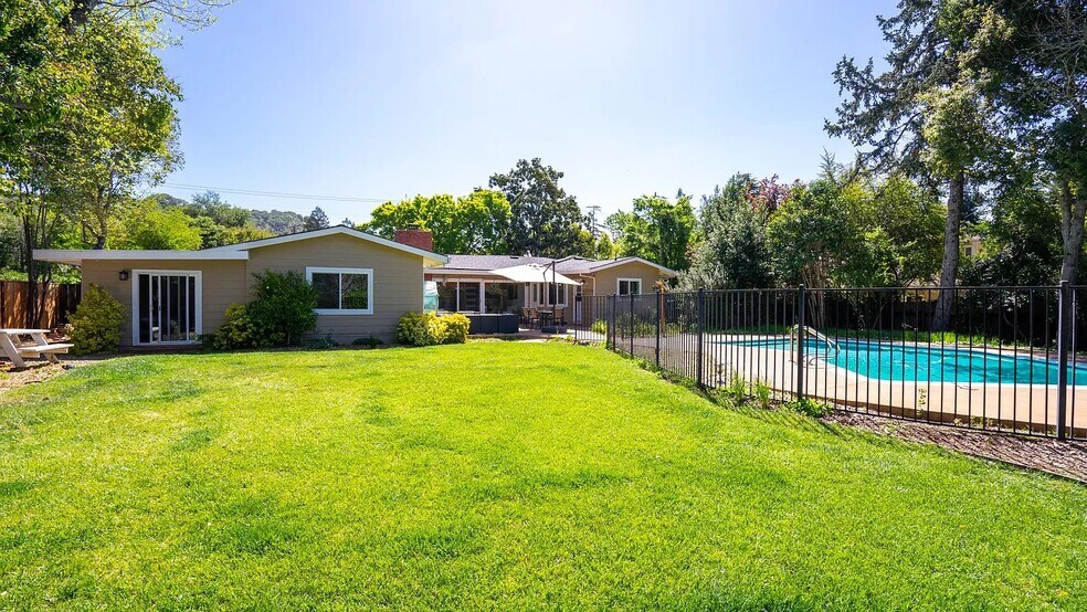 View from the orchard. The pool fence is now removed - 1415 Butterfield Rd