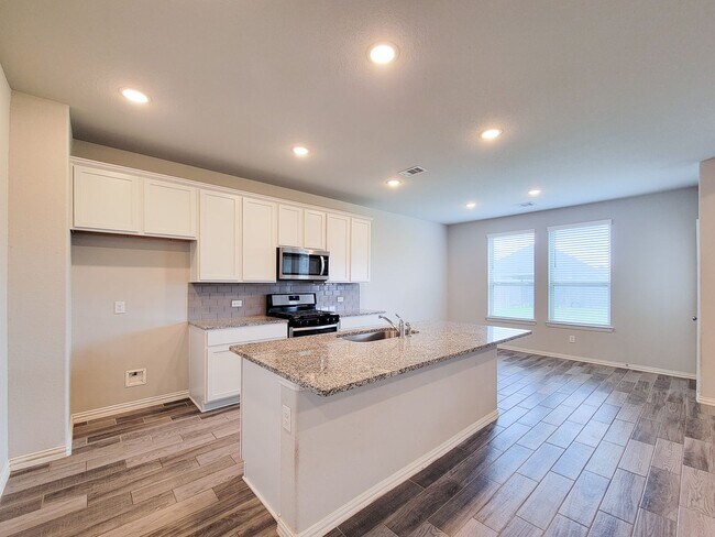 Building Photo - Quiet Cul De Sac! Tray Ceiling in Family & Primary suite. Wood Like Tile, Modern Gray Walls, Grea...