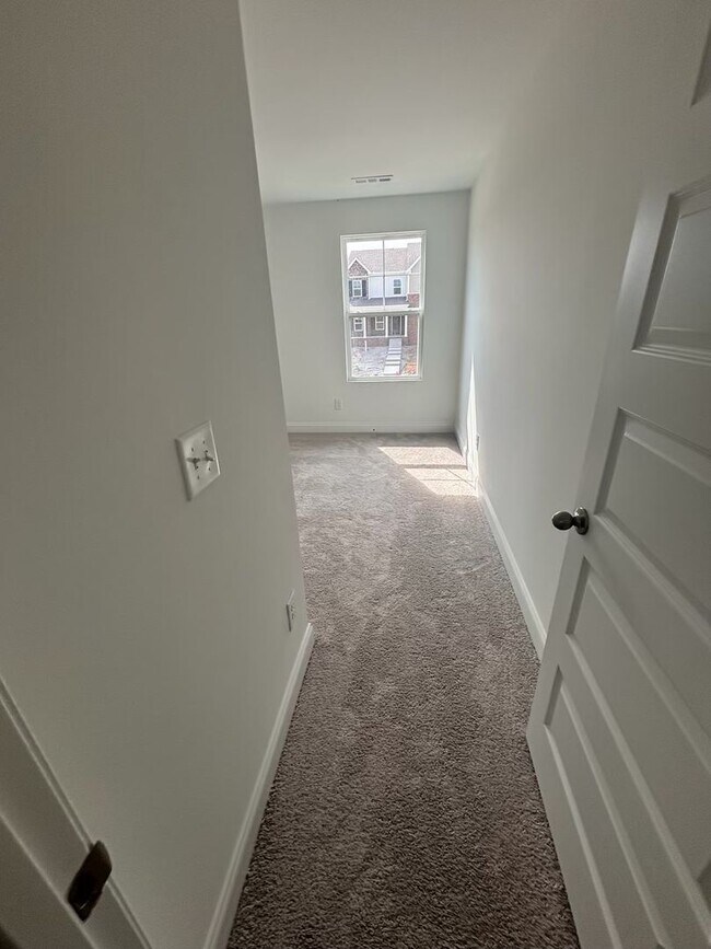 Building Photo - **BE THE LUCKY ONE TO LIVE IN THIS 2024-BUILT END-UNIT TOWNHOME IN A RESORT-STYLE COMMUNITY**