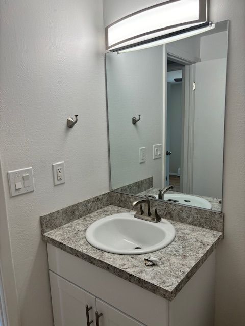 Experience sophistication with this elegant bathroom design, featuring a stylish vanity. - 591 West Prentice Avenue