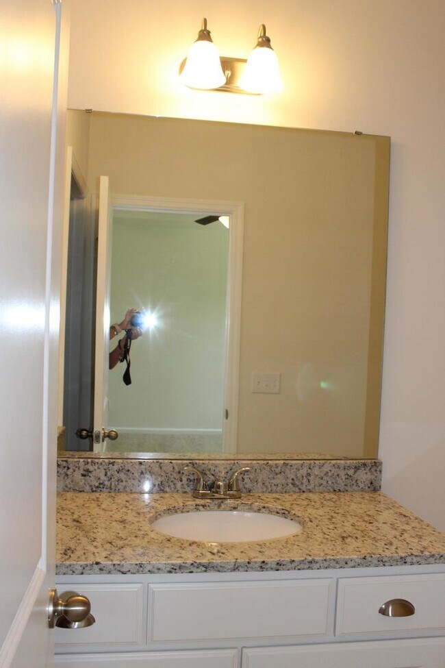 Building Photo - Sun-Filled 3-Story End-Unit Townhome with Fenced Yard, Storage & Resort-Style Pool