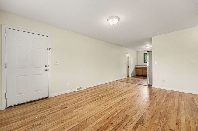 Building Photo - Spacious 3-Bedroom Home with Refinished Hardwood Floors, Fresh Interior Paint, Private Fenced Yar...