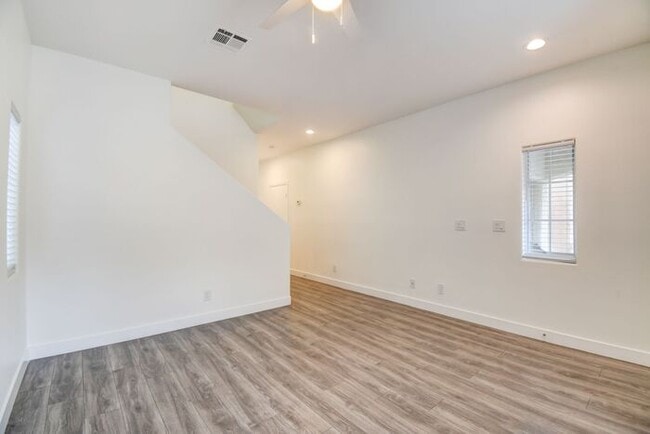 Building Photo - Great home with 4 bedrooms, 2.5 baths. New Floors Paint and Countertops.