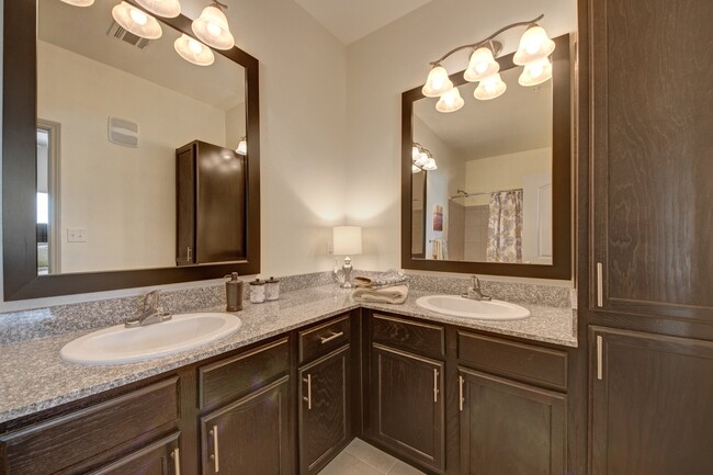 Double Vanities and Granite Countertops in the Master Bathroom - Liberty Pointe