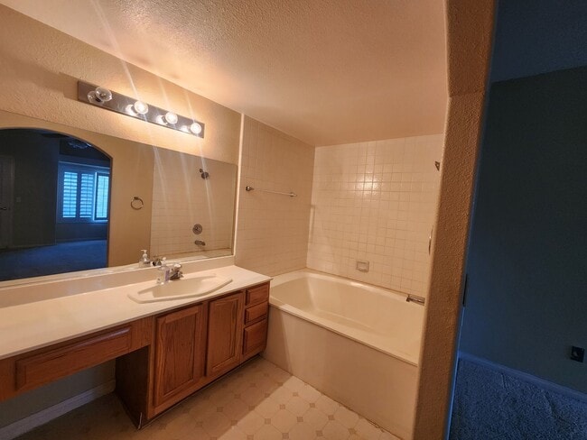 Building Photo - 2nd Story Condo in gated community close to the pool.