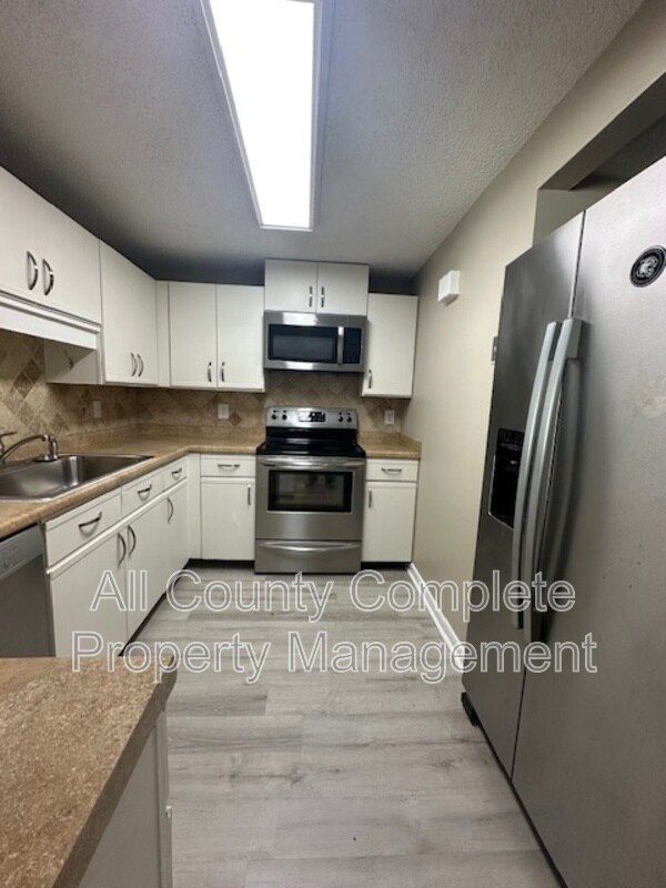 Building Photo - 6653 Periwinkle Dr