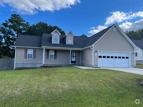 Building Photo - 3 Bedrooms and LARGE Backyard