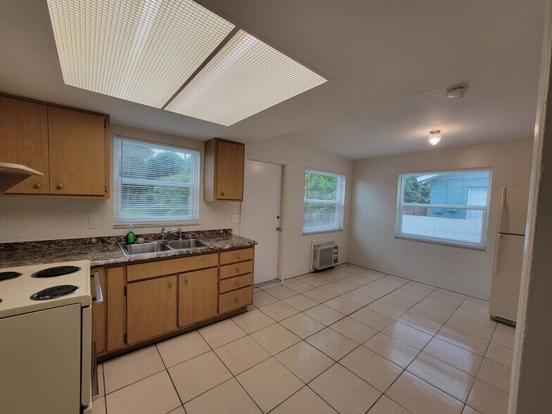 Kitchen/dining with windows open - 6100 Dr Martin Luther King Jr St N