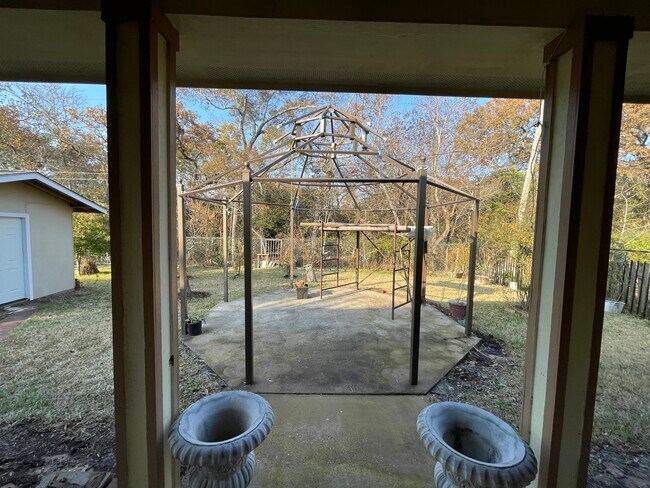Backyard covered patio view - 600 River Bend Dr