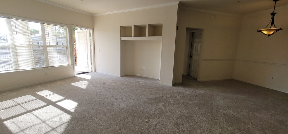 living room with build in entertainment center - 3707 Conroy Rd
