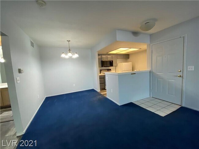 Building Photo - Cozy 1-Bed Condo in Gated 89128 Community ...