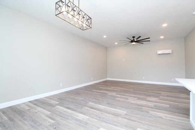 Building Photo - Fully Remodeled 2BR/2BA Attached Home with Garage, Modern Finishes, Park Views & Prime Downtown P...