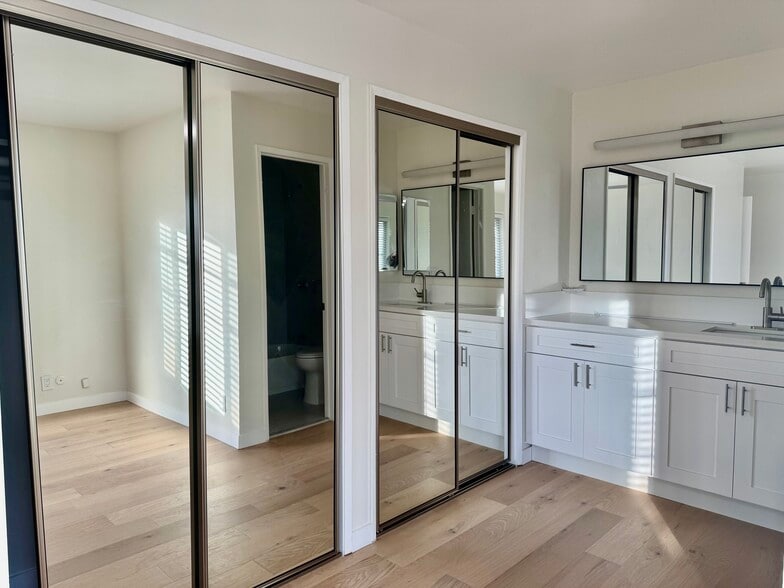 Large wardrobe closets with mirror doors - 4633 Marine Ave