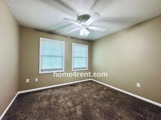 Building Photo - Blue Valley Schools w/ Wood Floors, Finished Basement and a Peaceful, Private Fenced Yard!