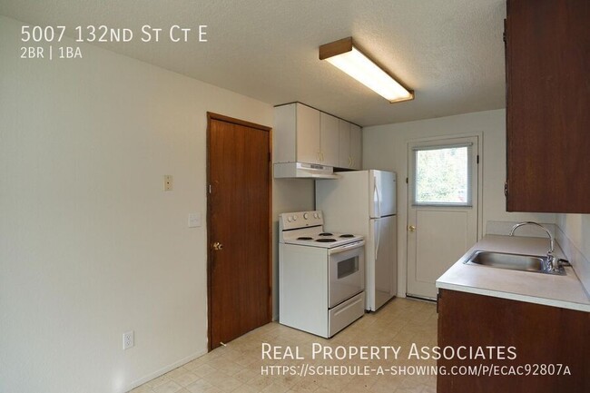 Building Photo - Spacious Two Bedroom Duplex Home with an A...