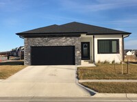 Building Photo - Spacious 4 bedroom/3 bath home with finished lower level and attached 2 car garage